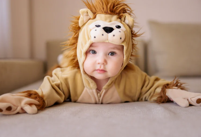 Baby in Lion Costume for World Wildlife Day Animal Names